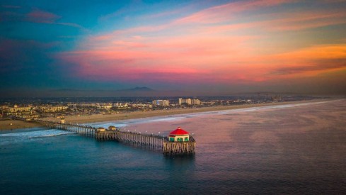 From the sea: aerial view of Huntington Beach Pier at sunset
